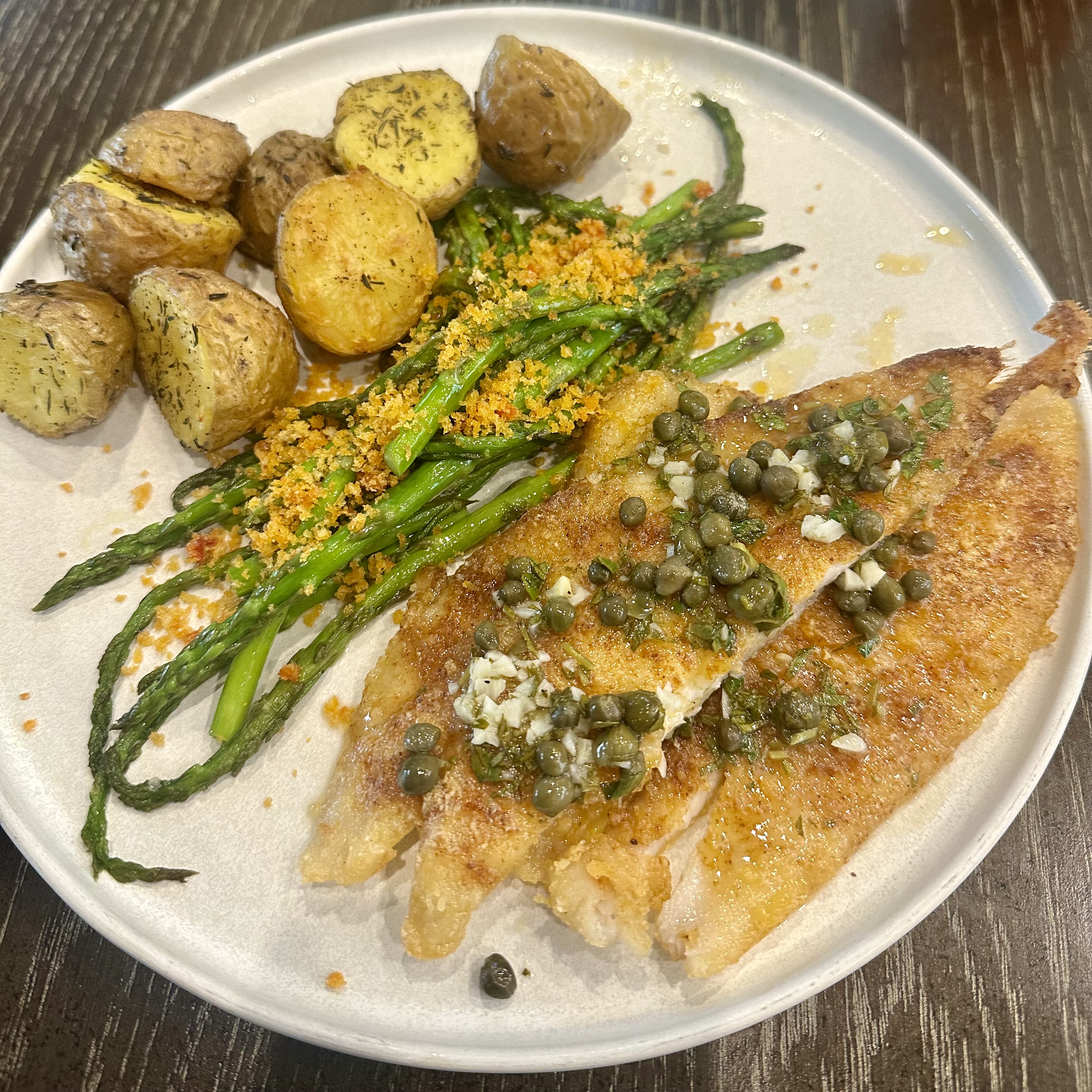 Pan fried flounder with lemon caper butter sauce, duck fat baby golds, and sauteed asparagus with chili oil breadcrumbs