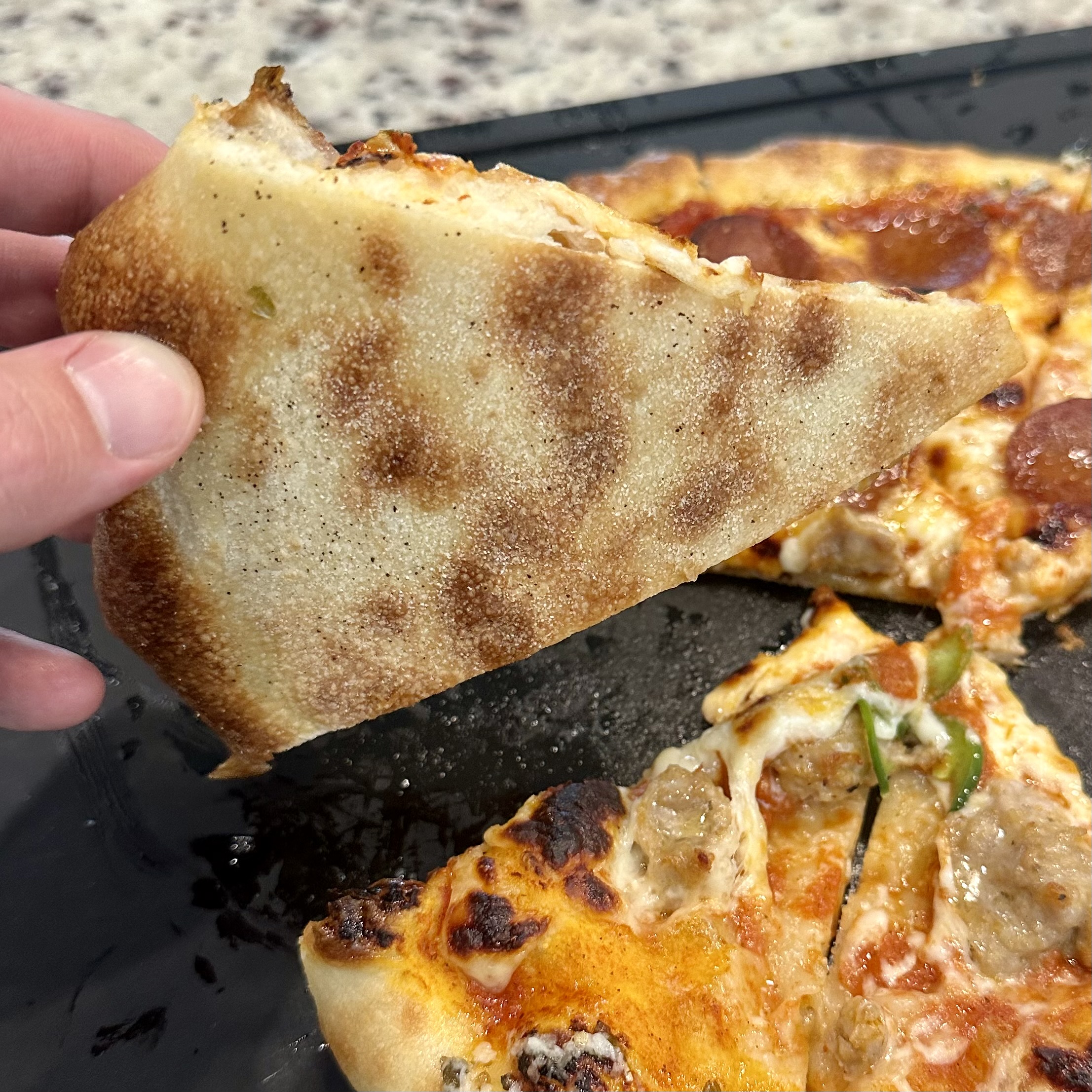 Undercarriage of pizza. Looked ok but can improve