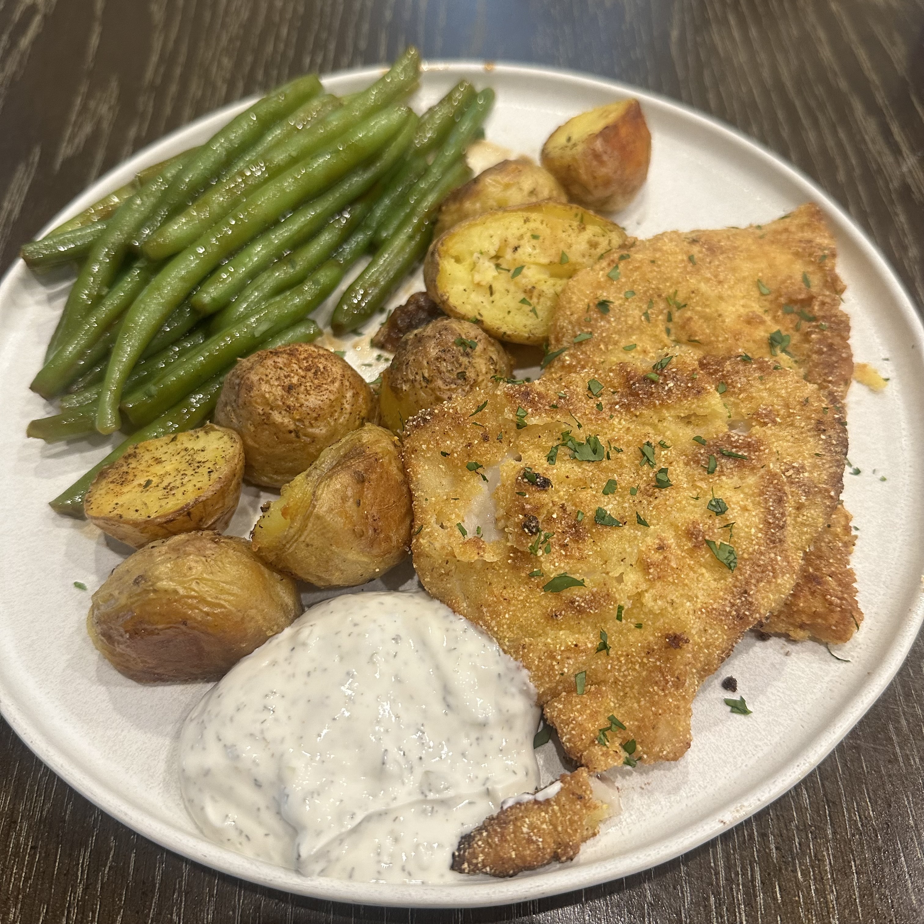 Cornmeal crusted fried flounder with roasted potatoes and greenbeans